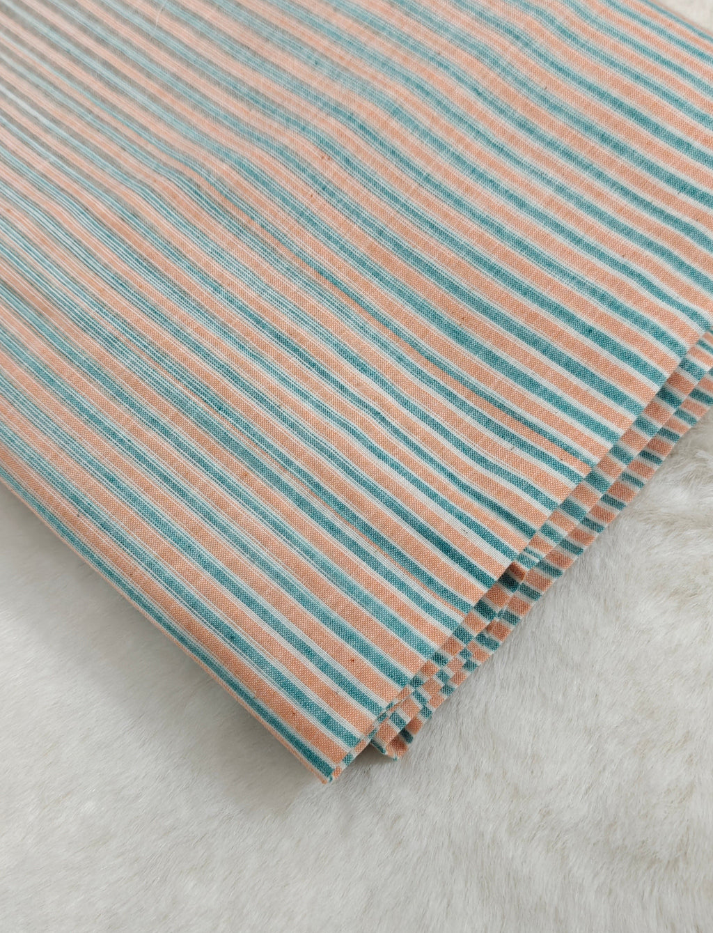 Handloom striped cotton fabric.
