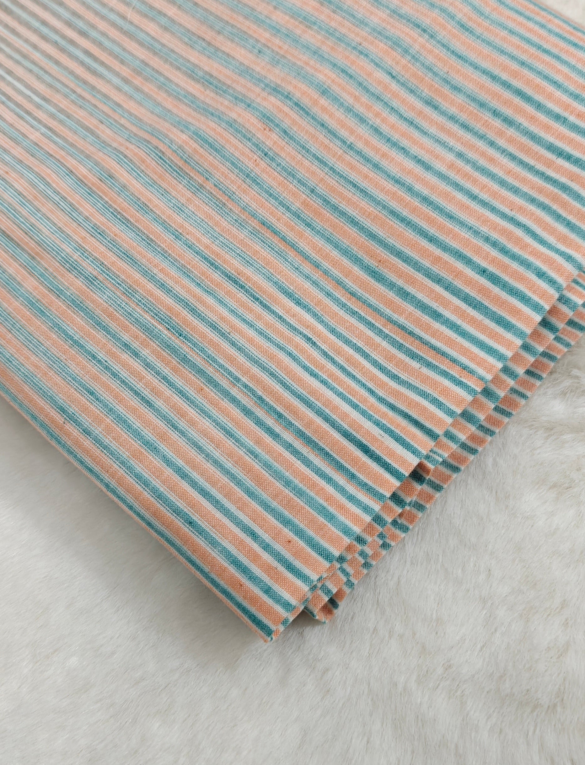 Handloom striped cotton fabric.