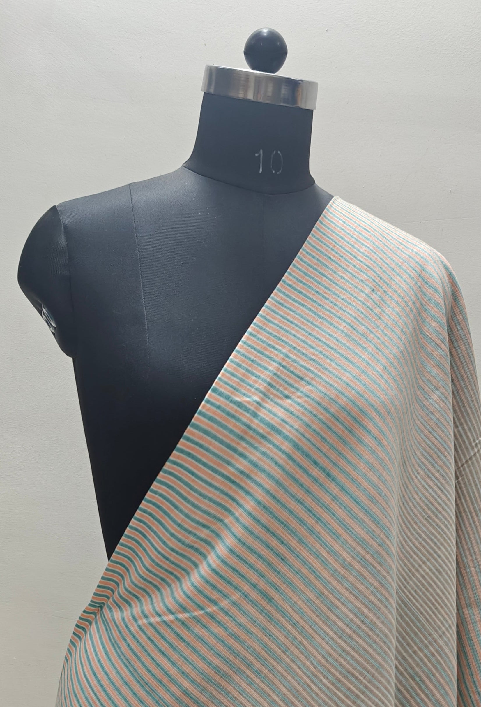 Handloom striped cotton fabric.