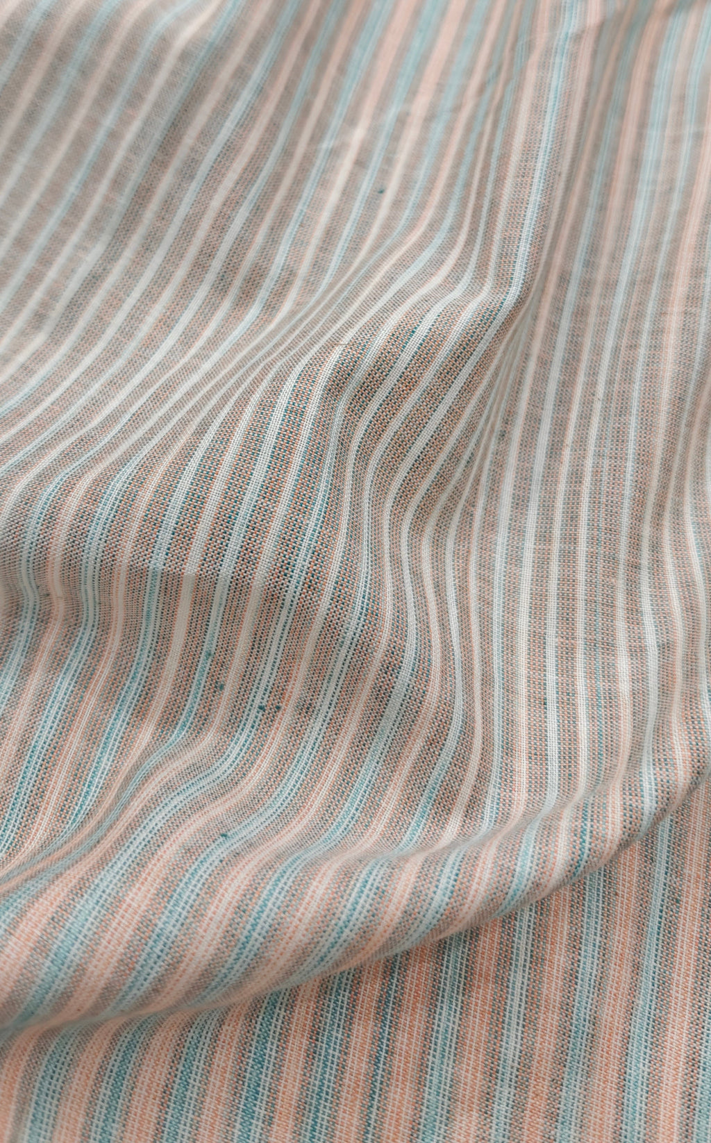 Handloom striped cotton fabric.
