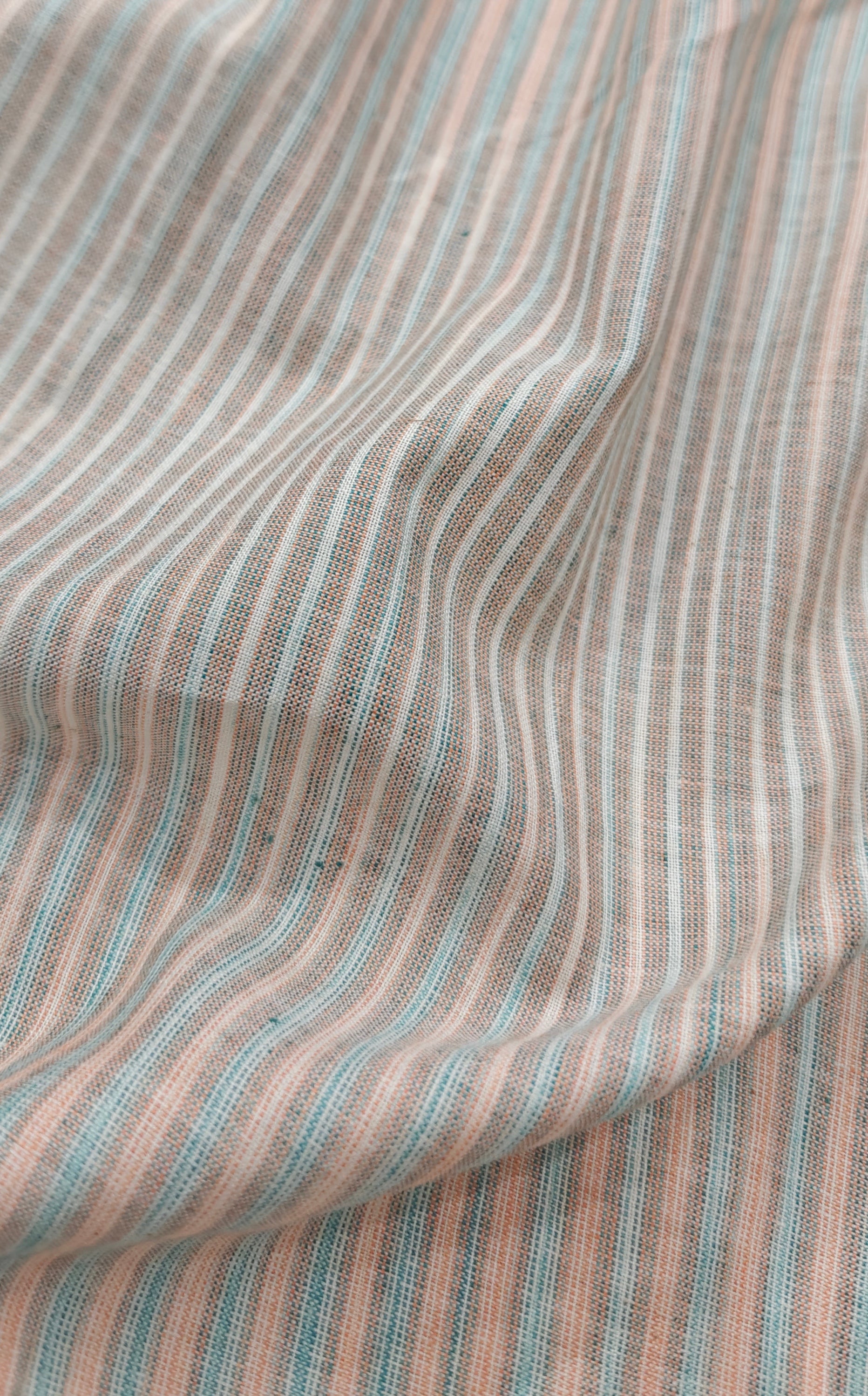 Handloom striped cotton fabric.