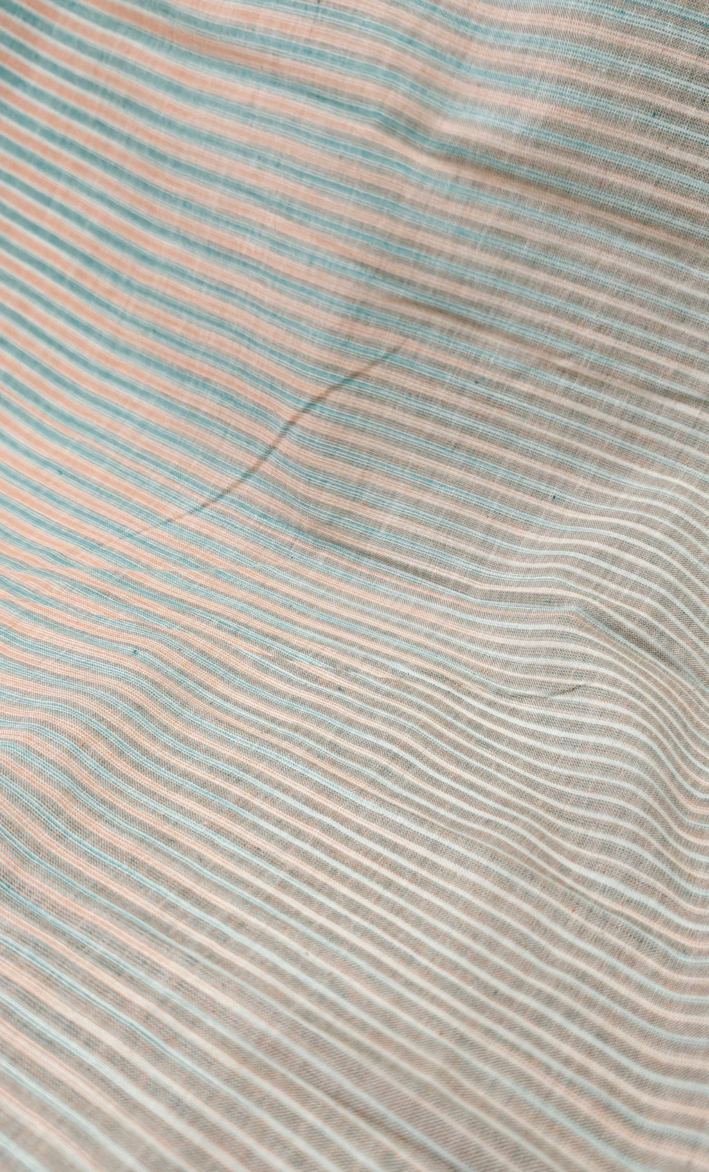 Handloom striped cotton fabric.