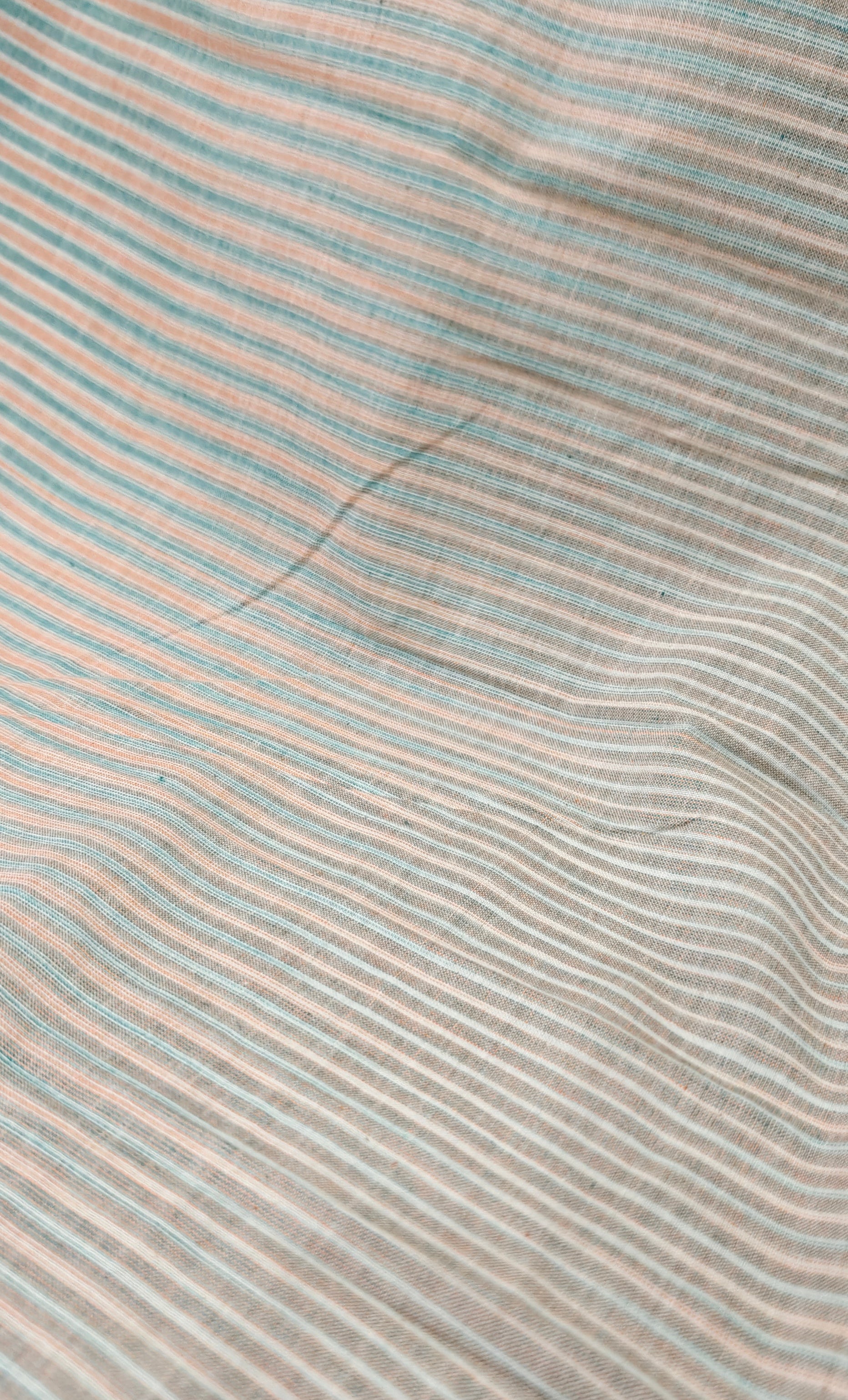 Handloom striped cotton fabric.